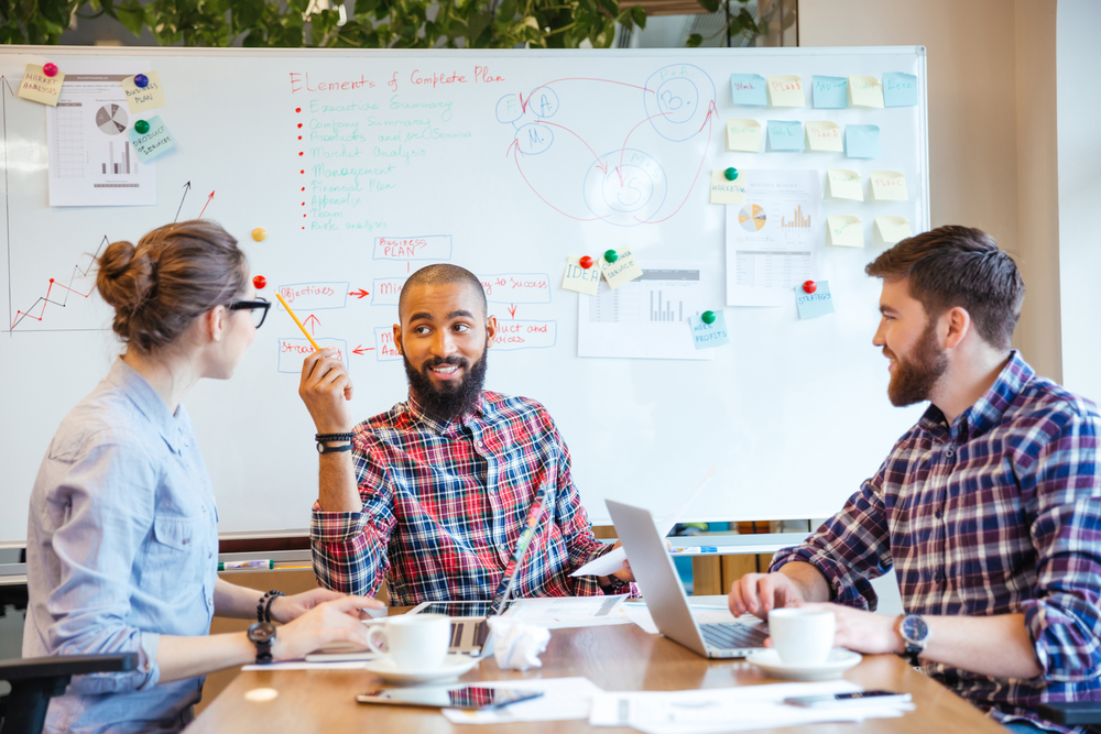 Multiethnic group of young people sitting in conference room and brainstorming on business meeting-Jun-01-2023-06-49-12-5507-AM